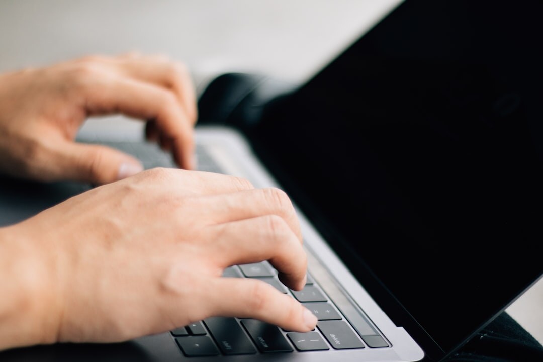 blogger typing on laptop