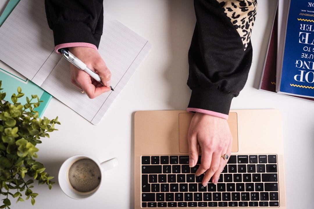 blogger typing on laptop