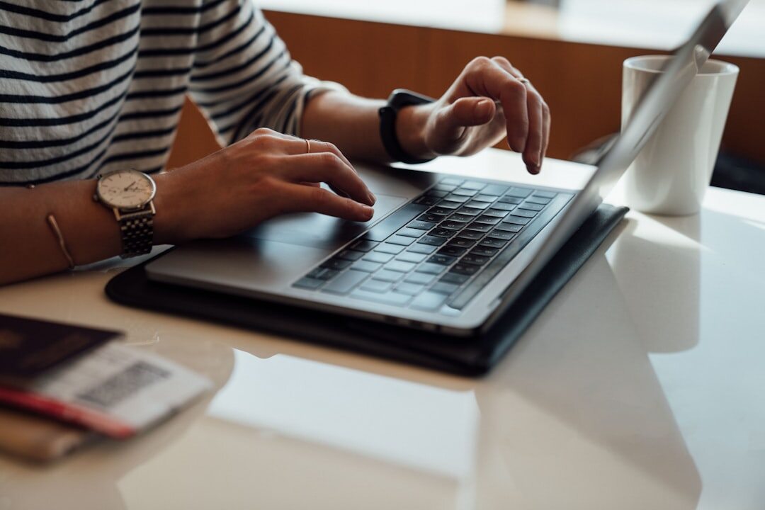 blog post writing on laptop