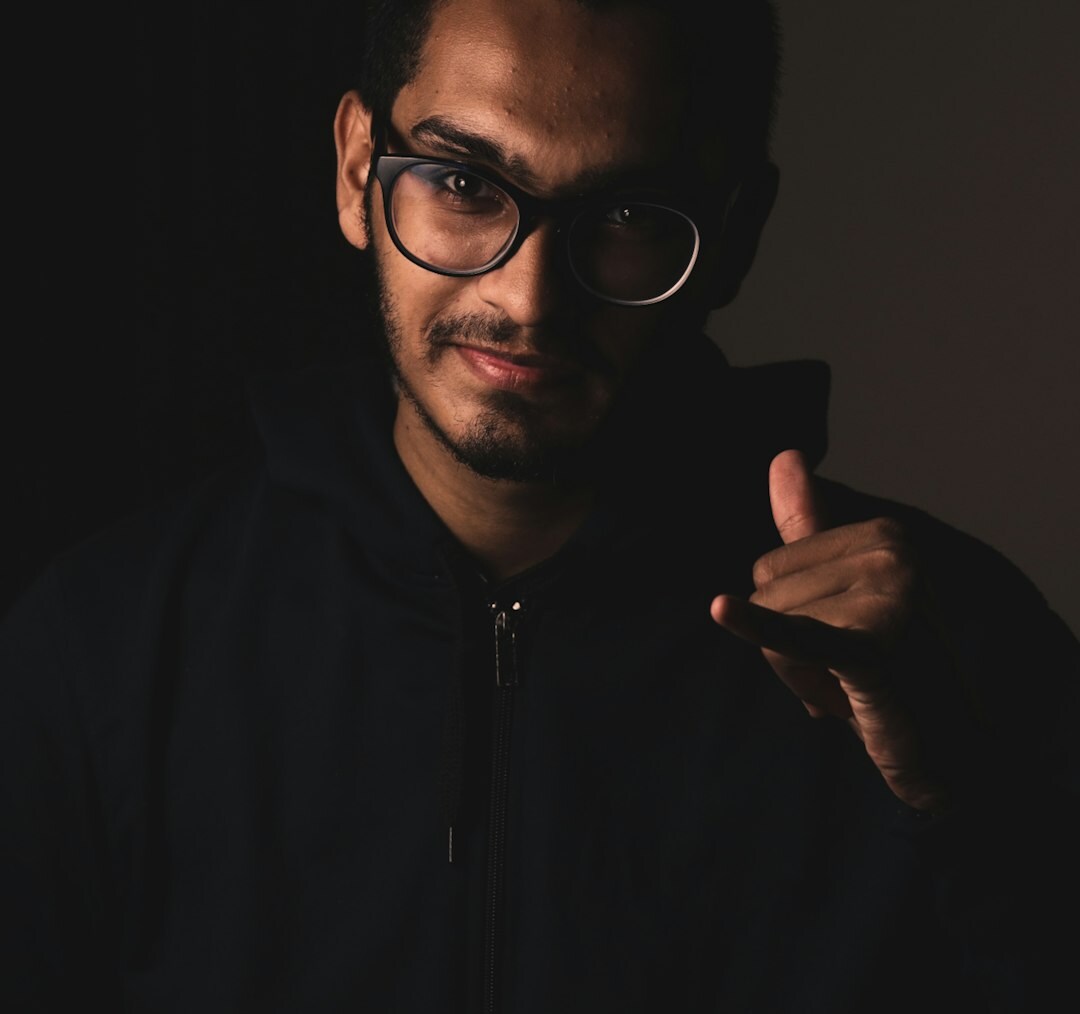 Studio portrait of a man wearing glasses