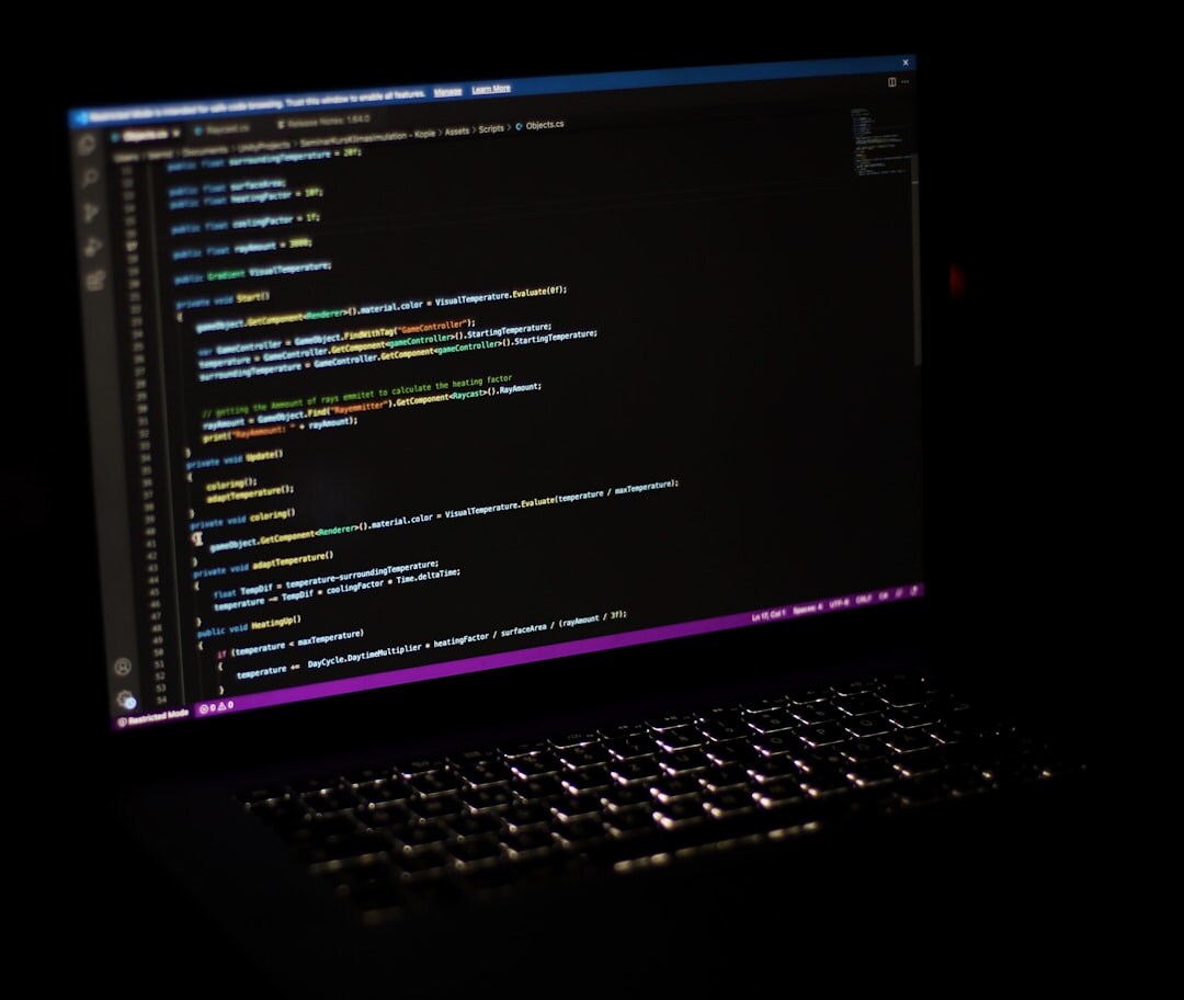 Laptop screen showing lines of programming code